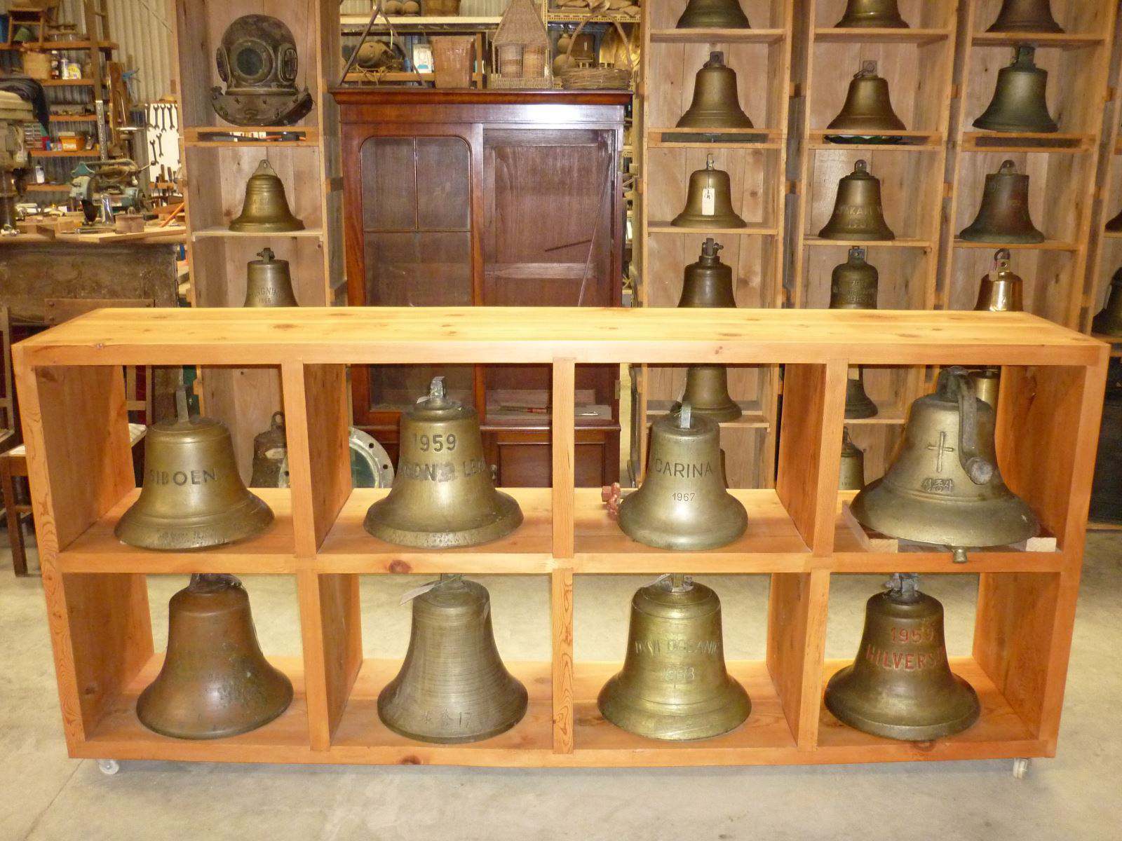 Ships Bells. ” 8 BELLS ” Large Ships Bells in Tailor- Made Pigeon-hole Unit.